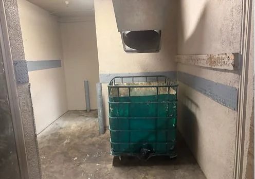 Clear trash chute opening and accessible collection bin at City Lights Apts after service