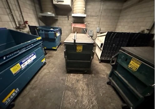 Collection bins and a cleared chute opening at Reata Oakbrook Village Apts after service