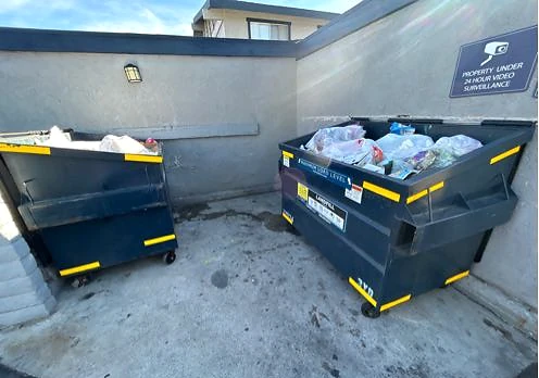 Waste contained in the dumpsters and loose ground litter cleared at Saddleback Ranch Apts after service